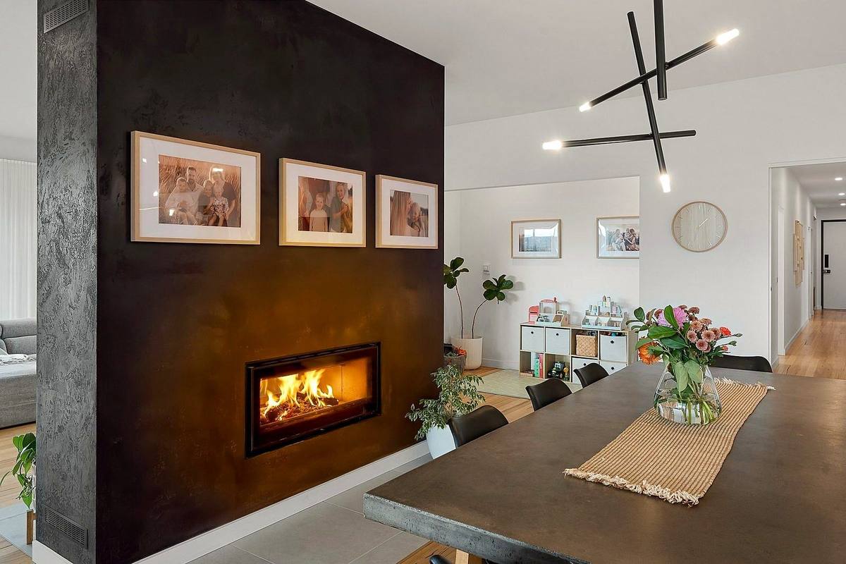 Pardalote new residence, dining with rendered fireplace wall, built by LHPL Contracting