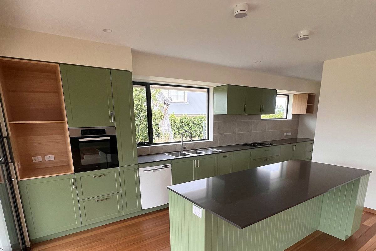 Richmond alterations and additions, kitchen with green joinery and timber floor, built by LHPL Contracting